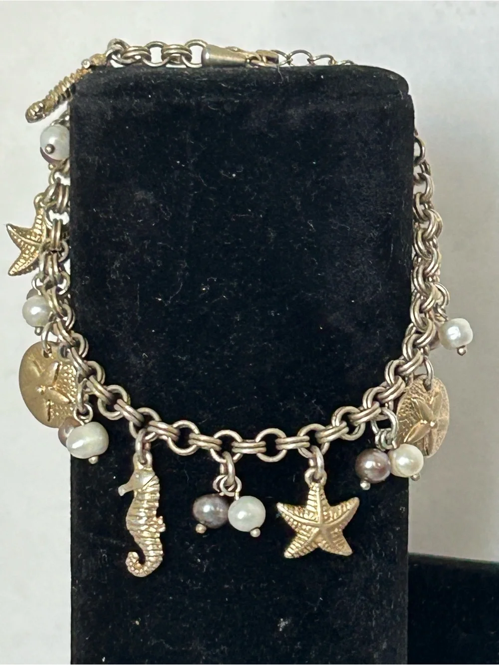 Gold-Tone Under the Sea Lia Sophia Seashell Charm Bracelet with Pearls (6) - Picture 1 of 6